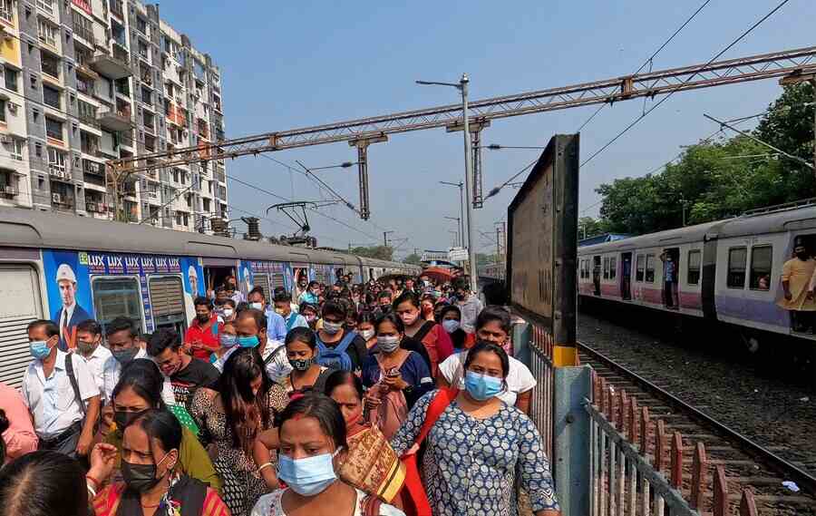 Commuters at Bidhannagar Road station on Monday morning. Local train services have resumed after a 6-month-long hiatus