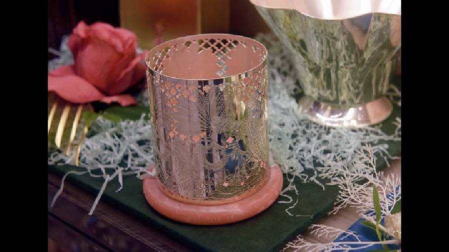 This silver tea-light holder placed on a lovely pink wooden platter with a suede base is easy on the eye and can brighten up your living room on Diwali night. Rs 15,000