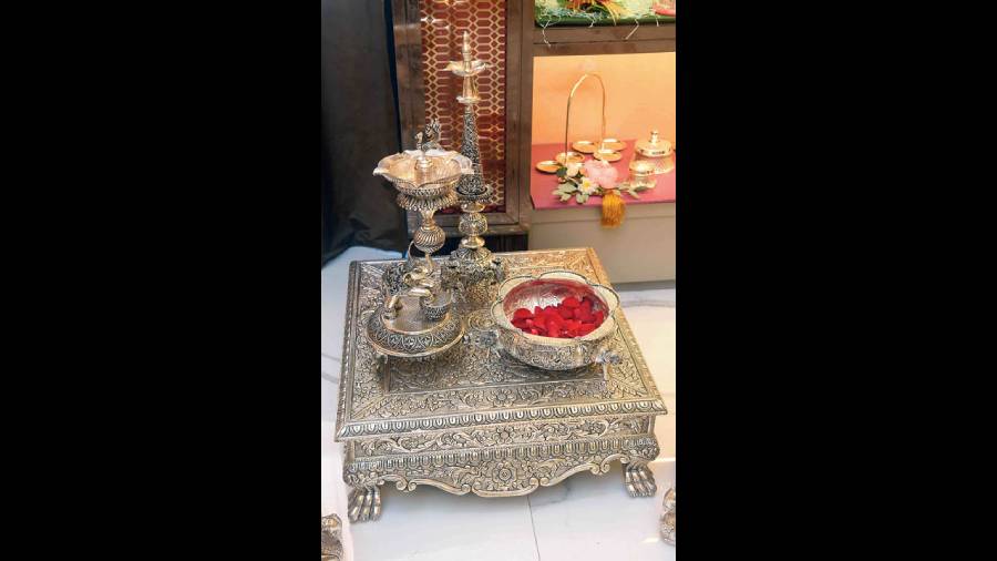This silver chowki with repousse work all over can be paired with urlis and long diya stands for a complete puja set up at your home or can be used as just a decor piece on Diwali. Price on request