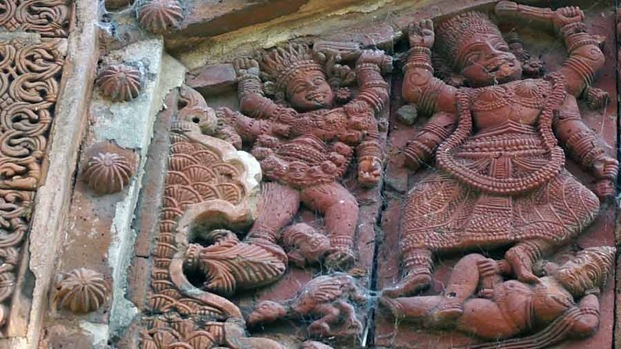 Terracotta plaque featuring Kali at a temple in Uchkaran, Birbhum.