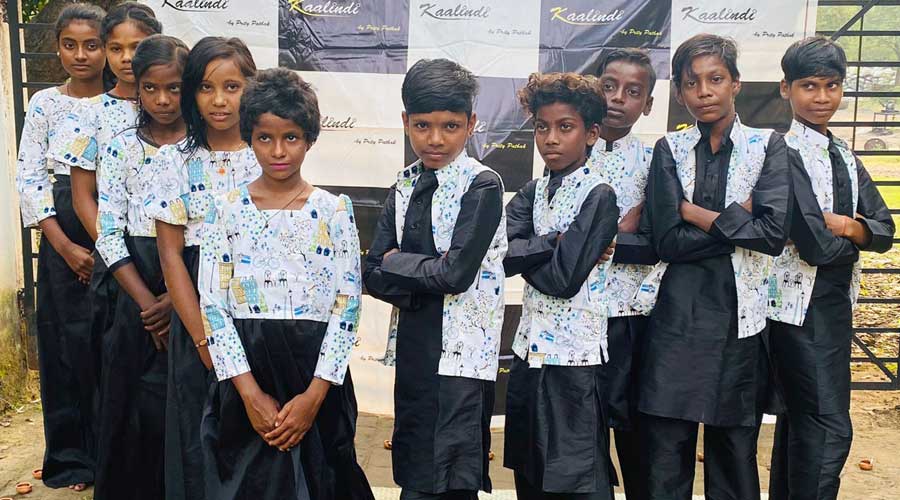 Children posing for photo wearing Preity’s designed dress that Preity gifted them for Diwali during a celebration at Bediatola in Pradhankhanta, Dhanbad on Thursday