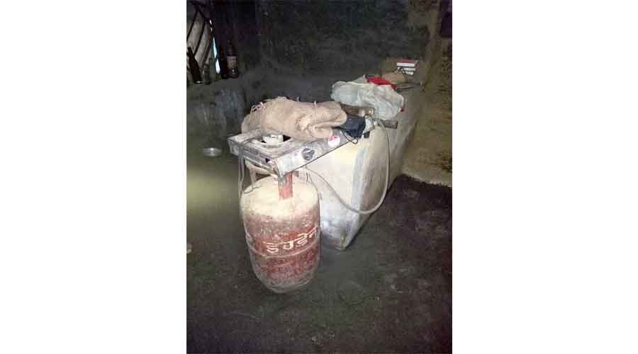 An abandoned LPG cylinder at a tribal home in Jhargram