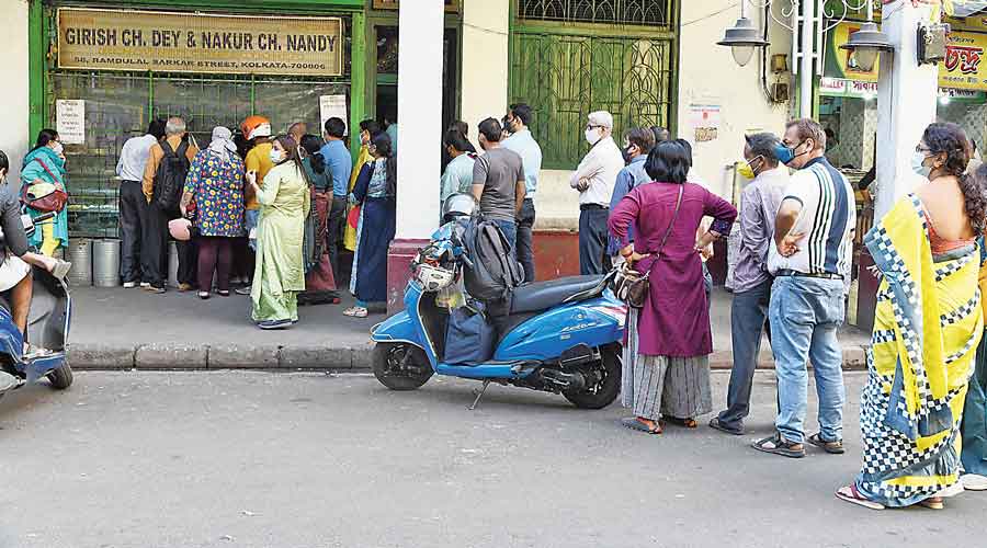Customers at sweet shops in north Kolkata on Friday afternoon.
