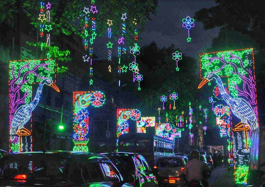 LIGHT & SPEED: Traffic flows past the lightings at Bowbazar in north Kolkata approaching a Kali Puja pandal on Wednesday, November 3