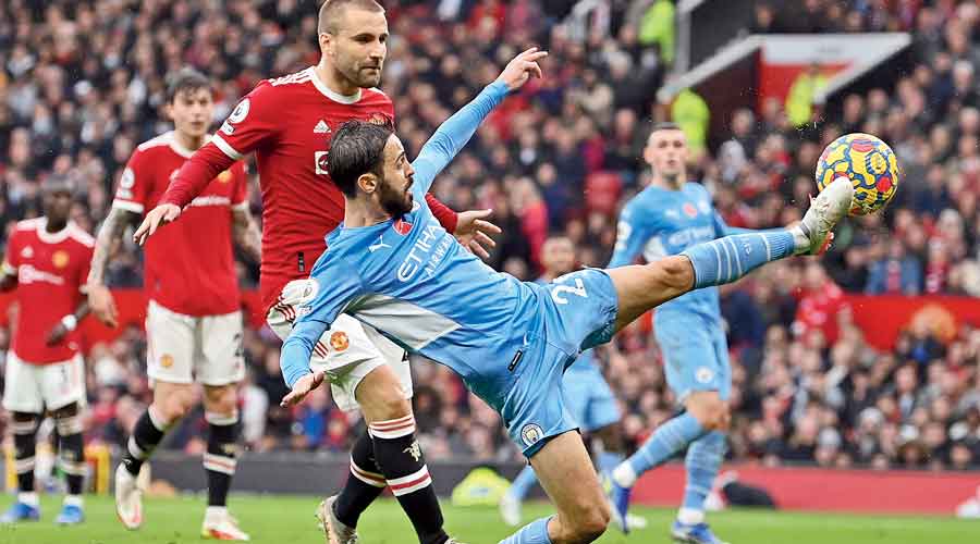 Bernardo Silva (front) scores Manchester City’s second goal against Manchester United  at Old Trafford on Saturday. 