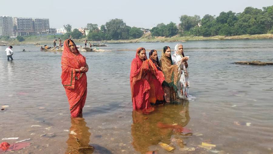 Chhath vratis offering prayers to Sun God after taking a bath at the Subernarekha river ghat at Sakchi in Jamshedpur on Monday. 