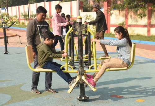Youngsters trying out one of the gym equipment at the open air gym