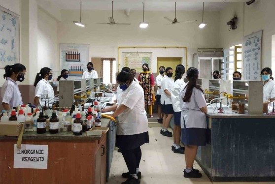 Students in the Chemistry laboratory for practical classes before Class XII examinations.