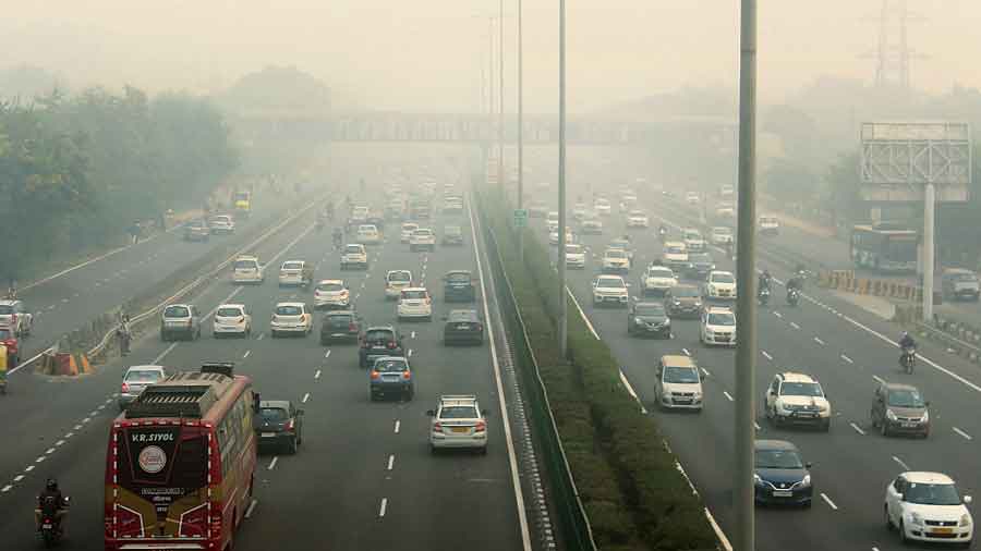 Vehicles ply amid low visibility on the Delhi-Gurgaon Expressway amid a thick layer of smog on Friday .