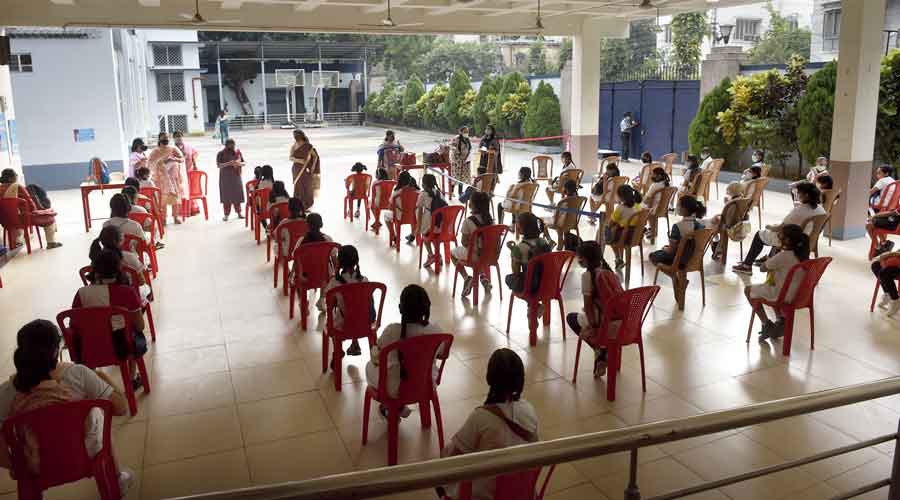 Sushila Birla Girls’ School students wait for the National Achievement Survey selection test on the campus on Friday.