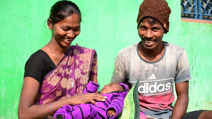 BUNDLE DELIGHT: A Matrujyoti beneficiary, Rashmi Kerketa, with her husband and child
