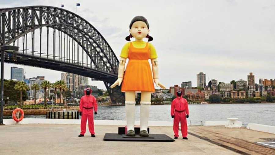 A life-sized replica of the creepy ‘Red Light Green Light’ doll from Squid Game has been a huge attraction at Sydney Harbour