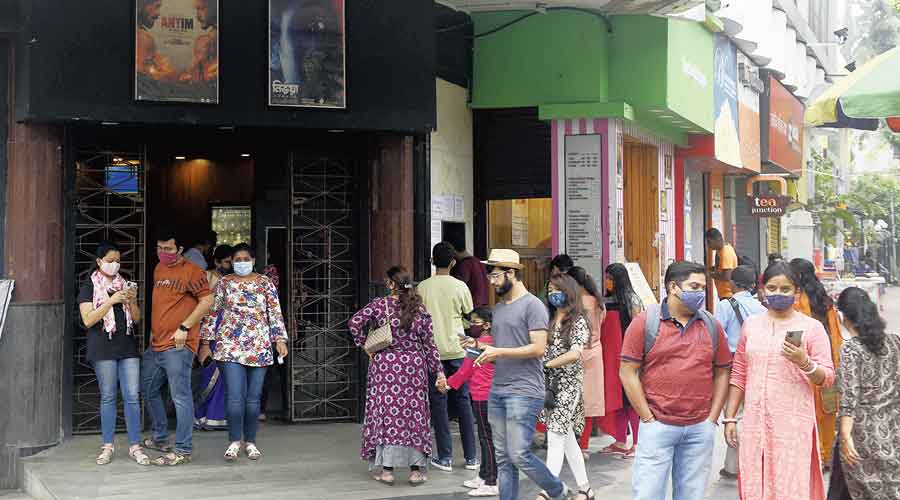 Movie-goers outside Priya Cinema on Saturday afternoon. 
