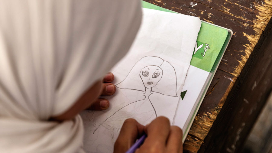 A student draws during an art lesson at a school for girls in Kabul on Sept. 15, 2021. 