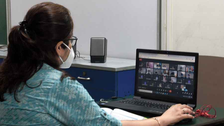 A teacher takes an online class at Sushila Birla Girls’ School on Monday.  