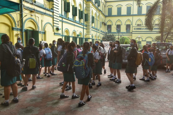 Schools in the city came back to life on November 16 as students of Classes IX to XII returned to the campus after a gap of 20 months. Students gather in the courtyard of Pratt Memorial School (picture above).