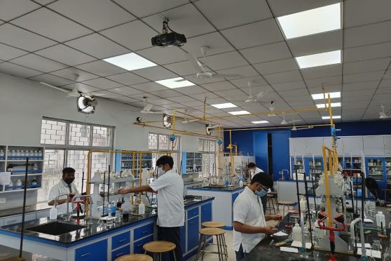 Practical classes have also resumed, Students at work in the Chemistry laboratory at Birla High School practise social distancing. 