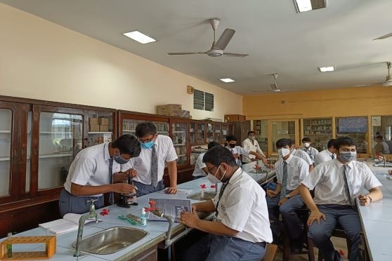 Students in the Biotechnology laboratory at Birla High School.