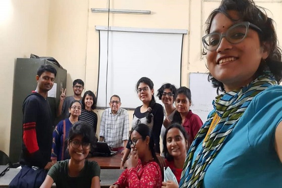 Abhijit Gupta, professor of English, with second-year students in the classroom. 