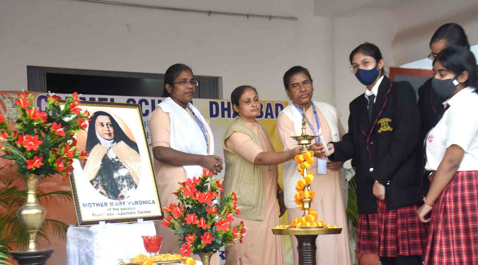 Teachers and students light the lamp on Monday