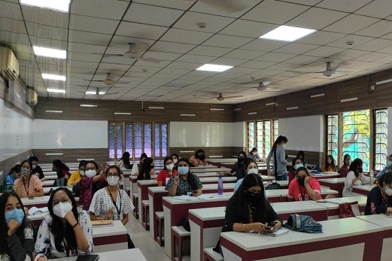 Third-year students of the English department at Shri Shikshayatan College attend classes after a long break. 