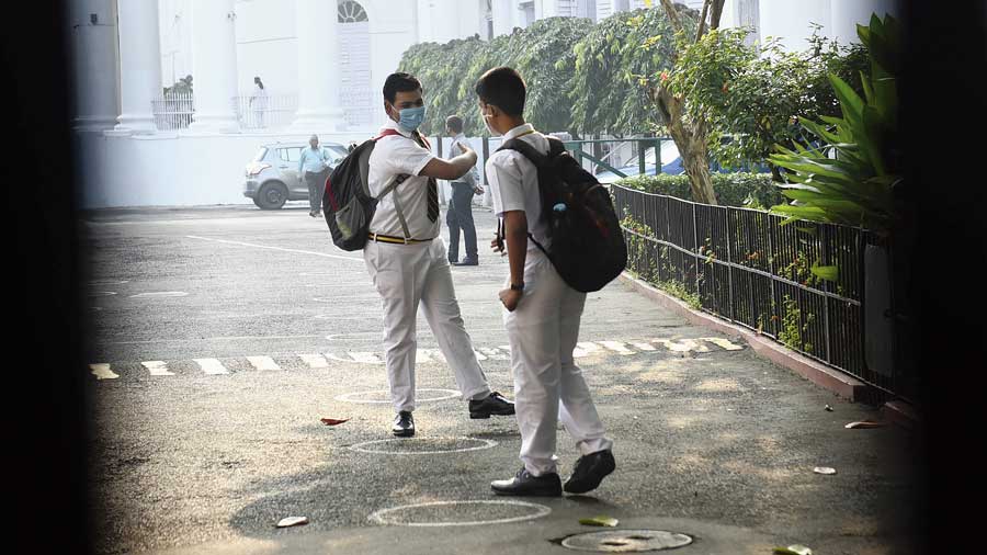 Students of La Martiniere for Boys greet each other on Day 1 of resumption  of on-campus classes on Tuesday. 