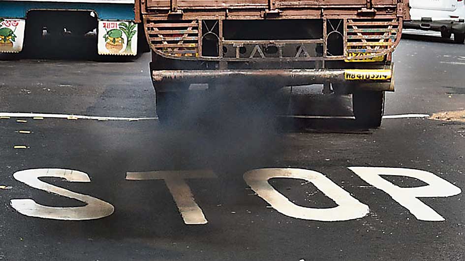 A truck emits black smoke in Kolkata.