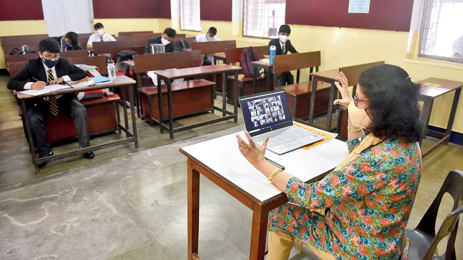 A teacher takes a hybrid (online and offline) class at La Martiniere for Boys on Tuesday when the higher classes  resumed onsite studies in several schools in Bengal after the pandemic-induced closure that stretched for more  than a year.