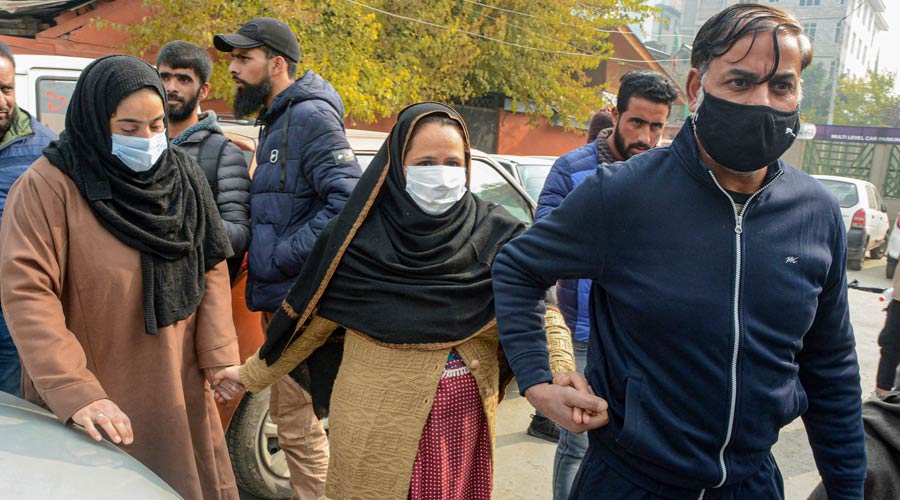 Family members of alleged OGW Mudasir Gul during their protest demanding Guls body for last rites, in Srinagar on Tuesday.