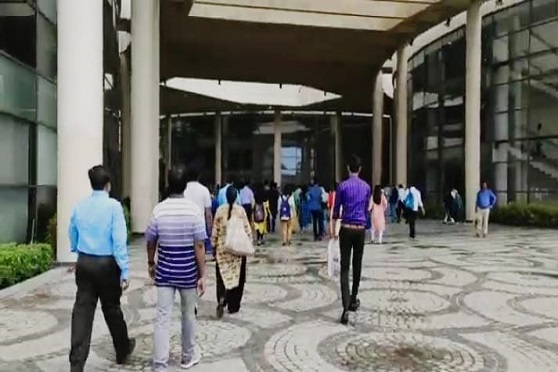Students of Amity University, Kolkata, enter the campus on Tuesday after a long break. 