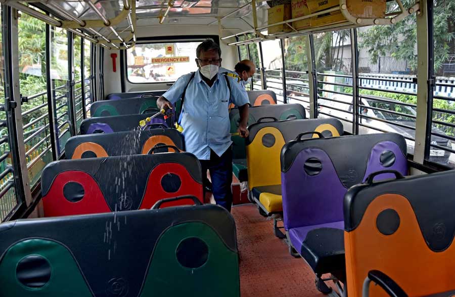 A school bus being sanitised at the BSS School in Ballygunge. On some campuses, the turnout was as low as 5 per cent, while some registered 50 per cent