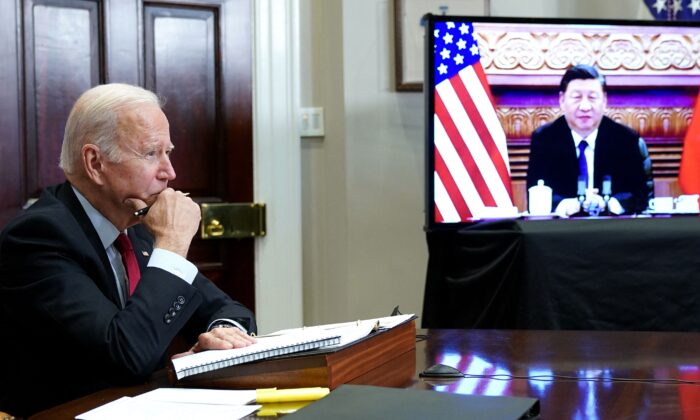 US President Joe Biden with Chinese President Xi Jinping on screen 