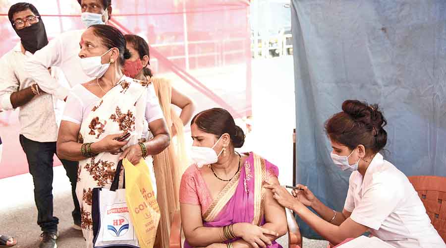 A beneficiary receives a dose of Covid-19 vaccine at Ghansoli station in Navi Mumbai earlier this week.