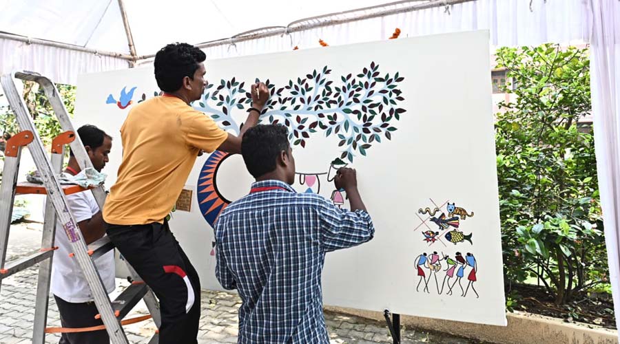 Tribal artists at work during Artisans' Residency at Vikas Bharti in Jamshedpur on Thursday. 