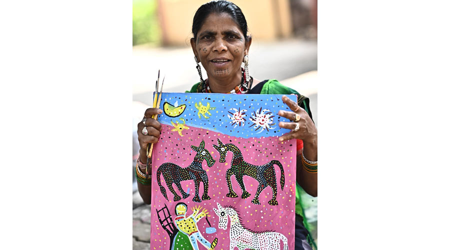 Lado Bai shows her work during Artisans' Residency at Vikas Bharti in Jamshedpur on Thursday.