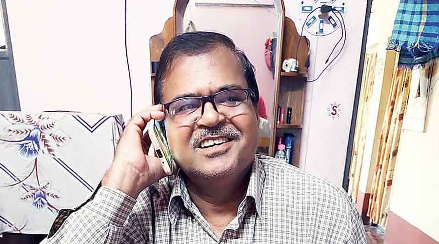 Hooghly farmer Somnath Ghosh celebrates the good news over the phone with another farmer.