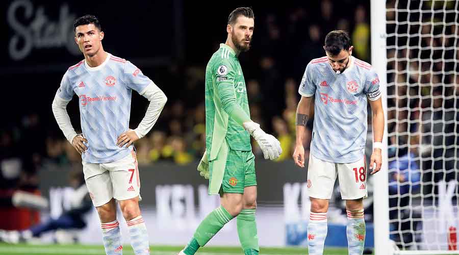 (From left) Cristiano Ronaldo, David De Gea and Bruno Fernandes after  Manchester United’s loss to Watford on Saturday. 
