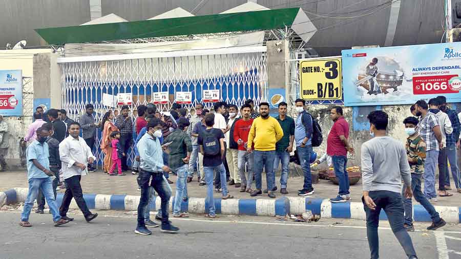 People outside the Eden Gardens on Saturday to pick up  tickets for Sunday’s match that they booked online. 