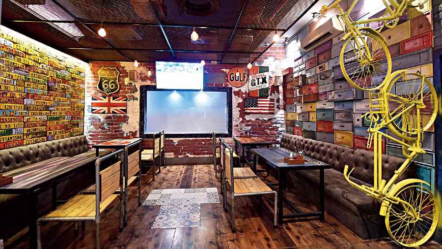 The inside section of the pub has extended seats for chilling with friends and family in groups. Interesting decor elements include vehicle number plates on one wall and colourful drawers on the other that were used as jewellery caskets in old Calcutta homes.