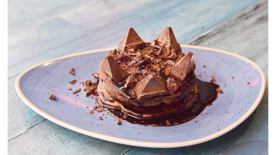 This Toblerone Chocolate Pancake Lasagne prepared in layers with chocolate sauce and Toblerone pieces on top, is pure sin! Rs 199