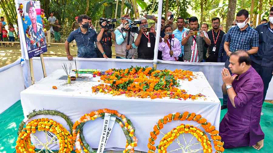Chief Minister Himanta Biswa Sarma pays tribute to Rifleman Suman Swargiary, who was killed in a terrorist attack on a convoy of Assam Rifles in Churachandpur, at his residence at Thailarakuchi in Baksa district, Nov 17, 2021. 
