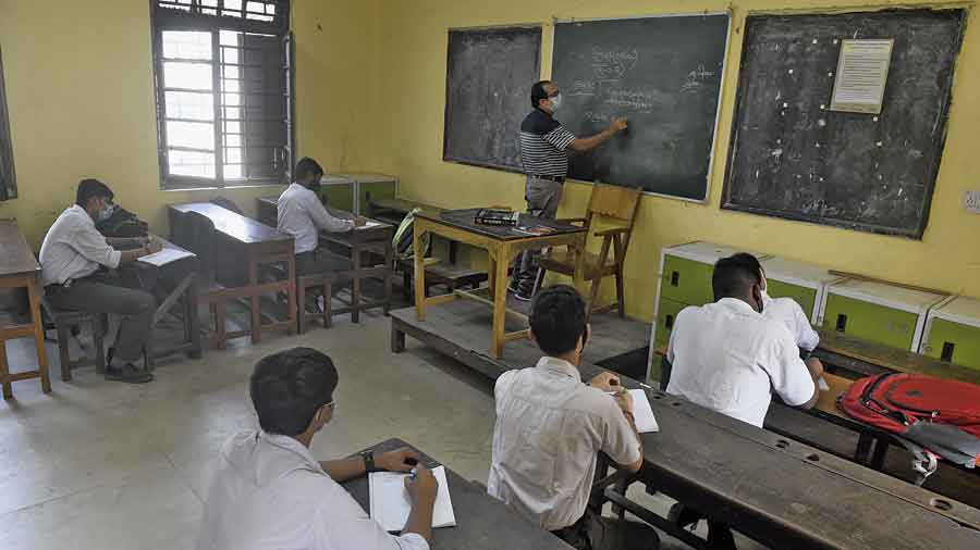 Students attend a class at Sanskrit Collegiate School in College Street on Monday. 