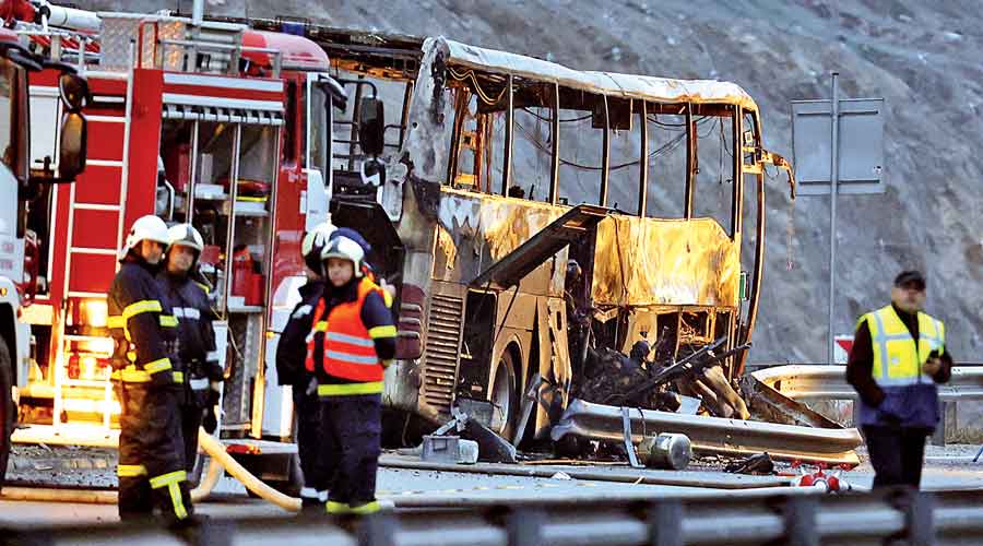 Firefighters and forensic officers at the scene of the bus crash near Bosnek, Bulgaria, on Tuesday.