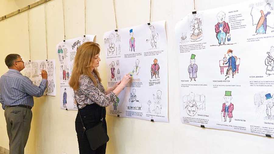 Illustrations of characters from Fyodor Dostoevsky’s works sent by the Dostoevsky Museum in St Petersburg being coloured at an exhibition at Gorky Sadan which concluded on Friday