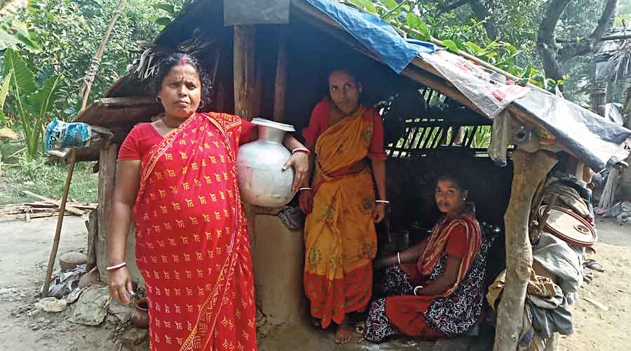 Members of the Mondal family in front of their shanty at Shibhati-Sangrampur village in Basirhat, North  24-Parganas, on Tuesday.