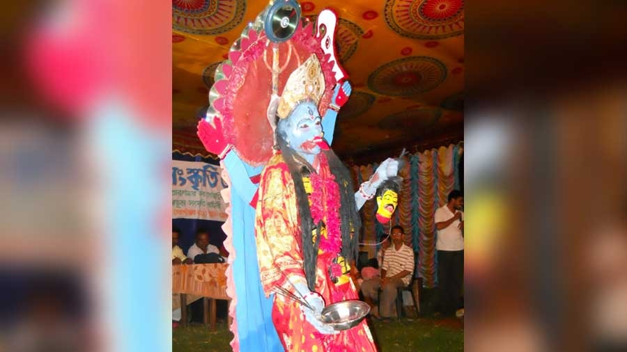 A Bohurupi dressed as Ma Kali