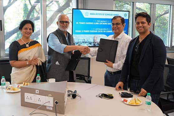 Distinguished Alumnus Pramod Chaudhari (second from left) and IIT Bombay director (second from right) Subhasis Chaudhuri after signing the MoU. 