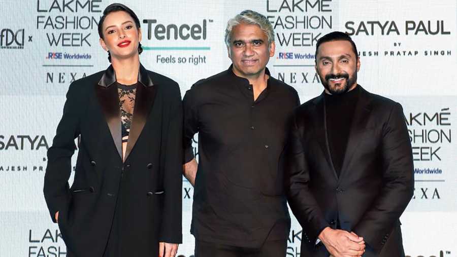 Rajesh Pratap Singh (centre) with show-stoppers Tripti Dimri and Rahul Bose