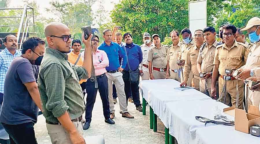 Officials of the state forest department check trap cameras during a hands-on training at Sajnekhali  in South 24-Parganas district.