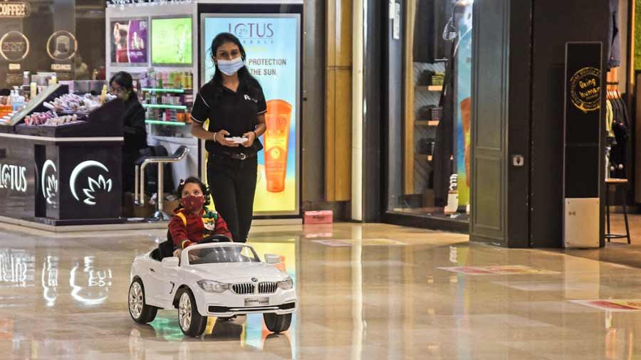 While the adults splurged, the kids were kept reasonably occupied riding the remote-controlled cars and we spotted this little one gliding about like a boss.